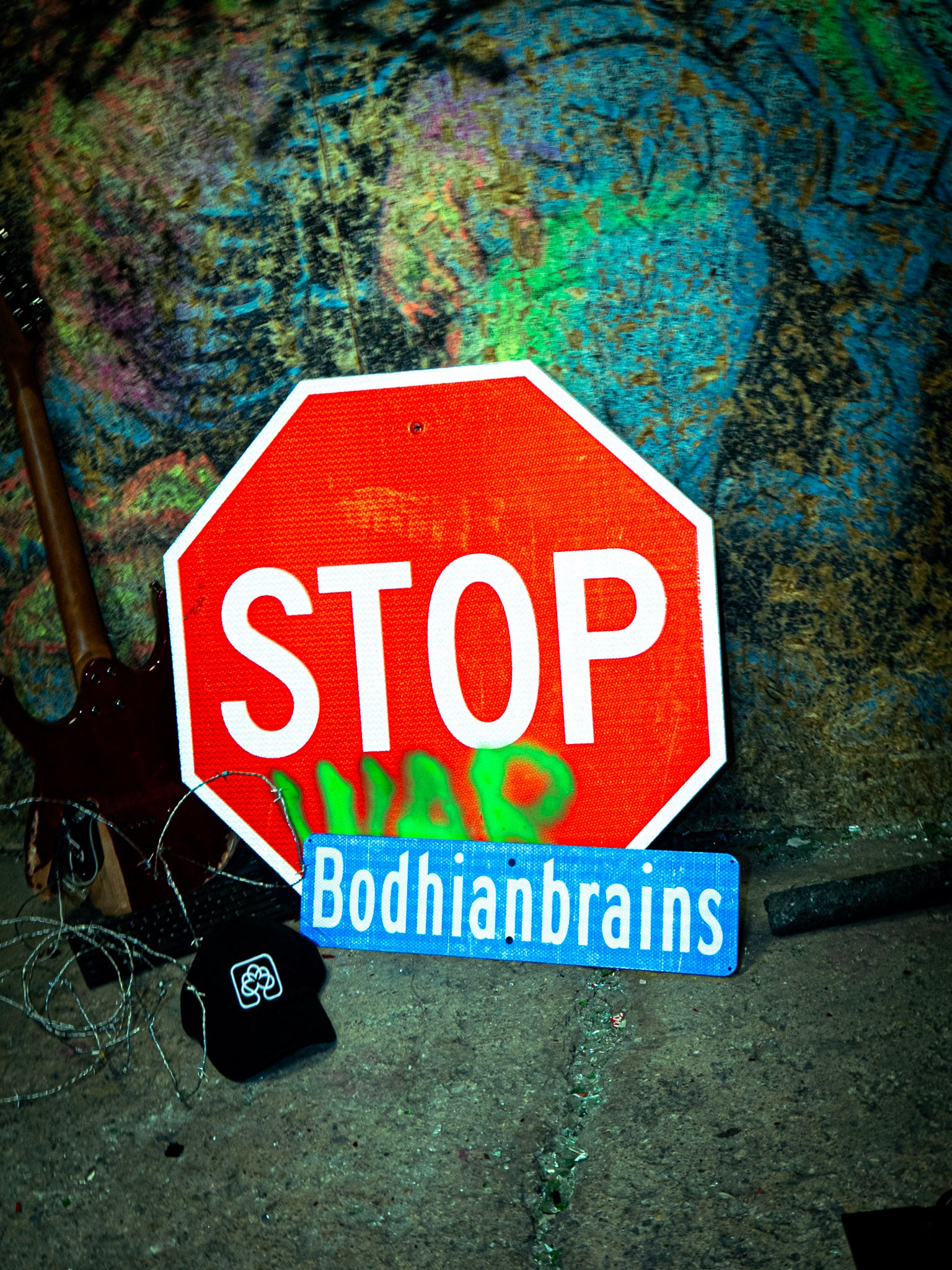 Stop sign with 'War' and 'Bodhianbrains' text on a textured background